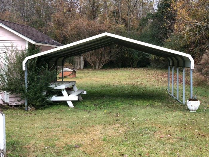 Metal carport.  Buyer must remove.