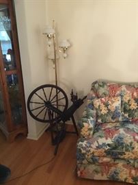 Antique spinning wheel and antique milk glass hobnail floor lamp
