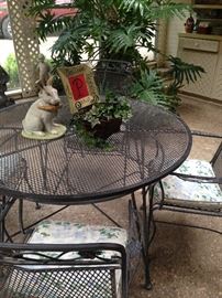 One of two patio tables with 4 chairs