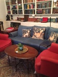 Another blue sofa; pair of red wing back chairs