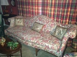 Classic camel back sofa; Asian silk pillows