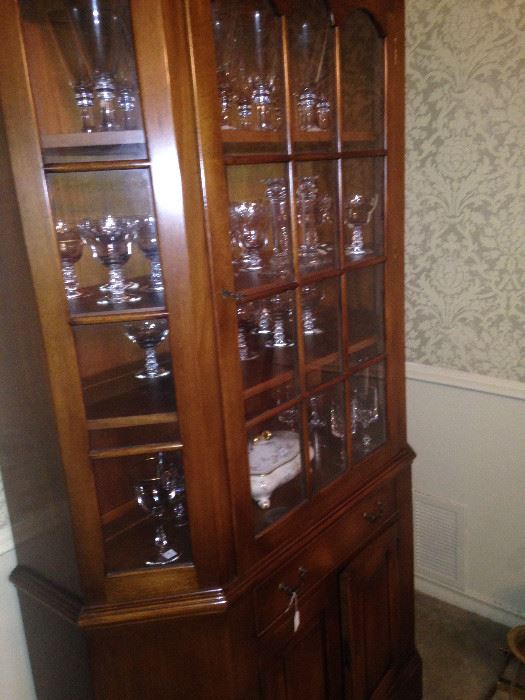 This lovely china cabinet provides display and storage spaces.