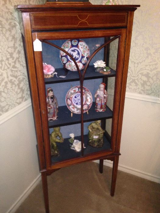 Handsome curio cabinet with Asian selections