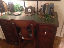 Fine looking green leather top desk (7 drawers)