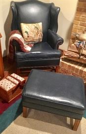Green leather wing back chair with grommets & ottoman