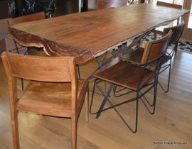 Absolutely Fabulous cypress Slab Table made in Apalachicola , metal base, 6 chairs and is just magnificent, will get measurements added soon.  This Slab is from a log found in the Apalachicola River, many years ago. The Table measures 8 feet by 36 inches.