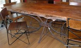 Absolutely Fabulous Slab Table made in Apalachicola , metal base, 6 chairs and is just magnificent, will get measurements added soon.  This Slab is from a log found in the Apalachicola River, many years ago.