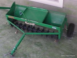 John Deere aerator with weight tray