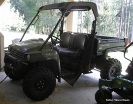 John Deere Gator model 825I  386 hours on this.