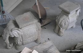 Two Concrete elephants, one had an accident