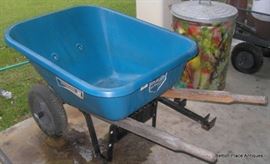 there are two blue wheelbarrows