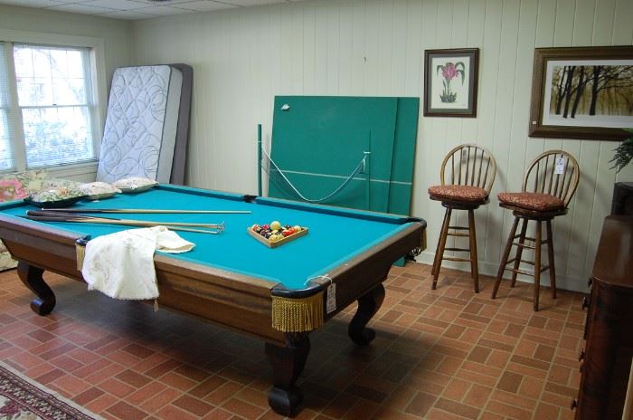 Pool Table- I could not find a name. It is full size and the accessories- sticks come with it. Against the wall is a custom made ping pong top that fits on the pool table so it it multi-purpose-sold separately