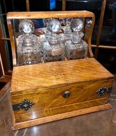 Early 20th c. Antique Oak Tantalus Set with 3 Decanter bottles and hidden drawer. Sterling Liquor Tags also available. 