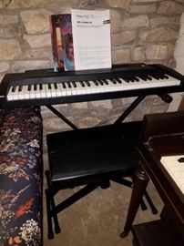 Roland keyboard with folding stand and set