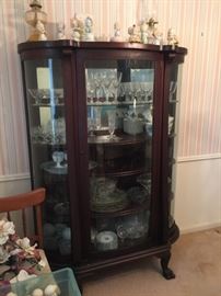 Bow front lion paw cabinet