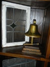 antique stained glass window and historic bell from Masonic Lodge