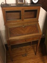 Beautiful small desk that also serves as a display cabinet