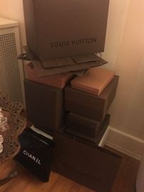Many empty Louis Vuitton boxes and shopping bags. A few Chanel too.