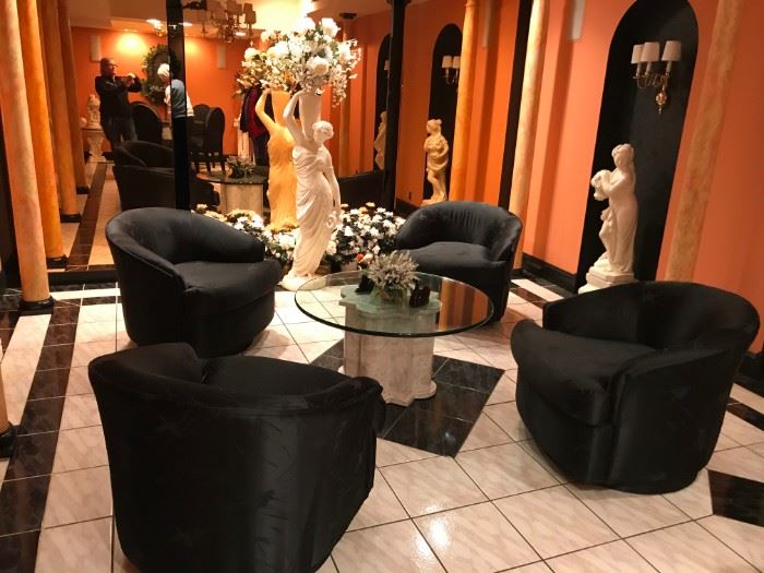 Statues & Glass Top Table, 4 Black Swivel Chairs