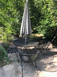#36 metal round table w 4 chairs and umbrella $100.00