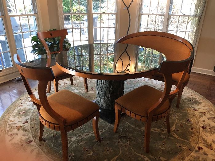 Custom table with a "tree bark" base.  Beveled black glass top is removable.  3 side chairs, cushioned, and a curved bench