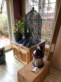 Southwest cabinet, bird cage, plants, outdoor lantern