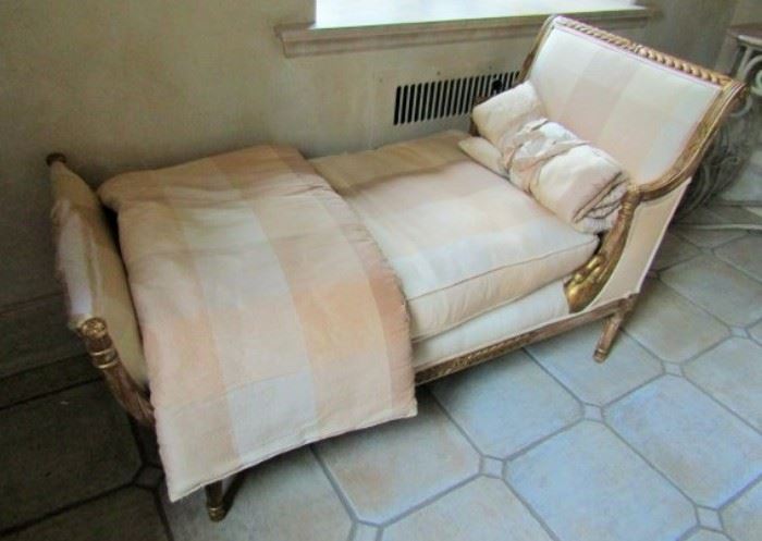 Daybed covered in silk fabric