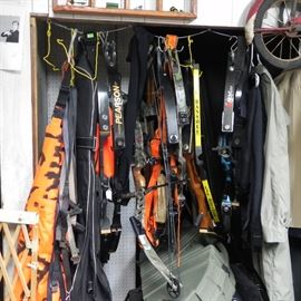 A large collection of hunting bows and accessories. Including several quivers and quick releases. 