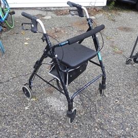 A nice adult walker with seat and hand-brakes. 