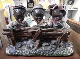 This neat yard ornament is very hard to come by. It has been damaged and needs repair but is still a nice example of artwork from the 1930's. Measures about 14 inches tall and 20 inches wide. 