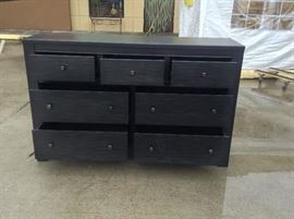 With its gently weathered sensibility, Wesling dresser is a natural fit for outfitting a peaceful sanctuary. From its subtle rubbed finish with peek-through distressing, to its simple, blocky profile, it’s a piece that makes a statement by being remarkably understated. Seven drawers beautifully accommodate your wardrobe needs.Made of veneers, wood and man-made wood;
Antiqued bronze-tone hardware; 7 smooth-operating drawers; Top drawers with felt bottoms; Made by Ashley; 66"W x 18"D x 42"H; $400; Retails @ $1,500; ref #: 19931