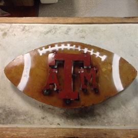 Texas A&M Metal Football; Meant for Outdoor Use; Hand-Made in Mexico; 3 Available; 22"W x 2"D x 12"H; $24; ref #: 911