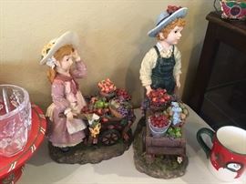 Italian children with flower and vegetable pushcarts