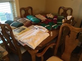 Napkins and placemat sets along with additional tablecloths in various sizes and shapes