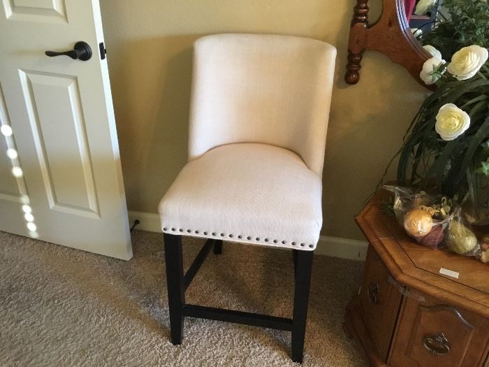 Upholstered bar stool with nail head trim