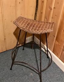 Stool. Wrought iron with woven seat. 15' by 10" by 27'. Good condition.