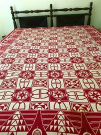 Red and off-white throw, bedspread, fabric.