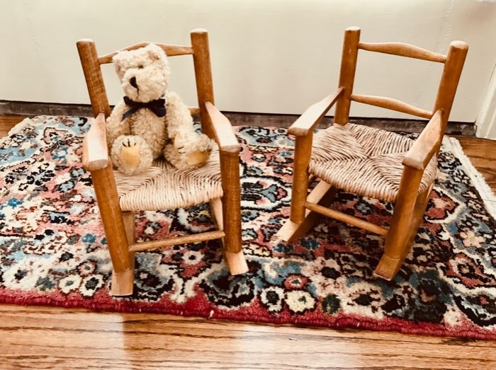 Two wood and woven chairs for dolls or stuffed animals.