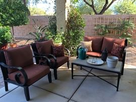 Nice Patio love seat and two chairs with coffee table.