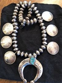 Sterling squash blouson necklace with silver dollars.