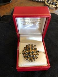 Gold broach with blue sapphires. 