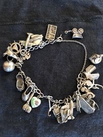 Sterling charm bracelet with traveling charms.
