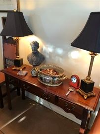 sofa talbe, timeless lamps, with assortment of decroations. 