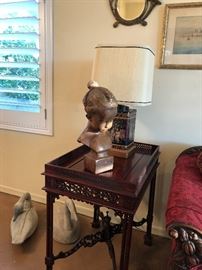 End table with elaborate carved wood. 