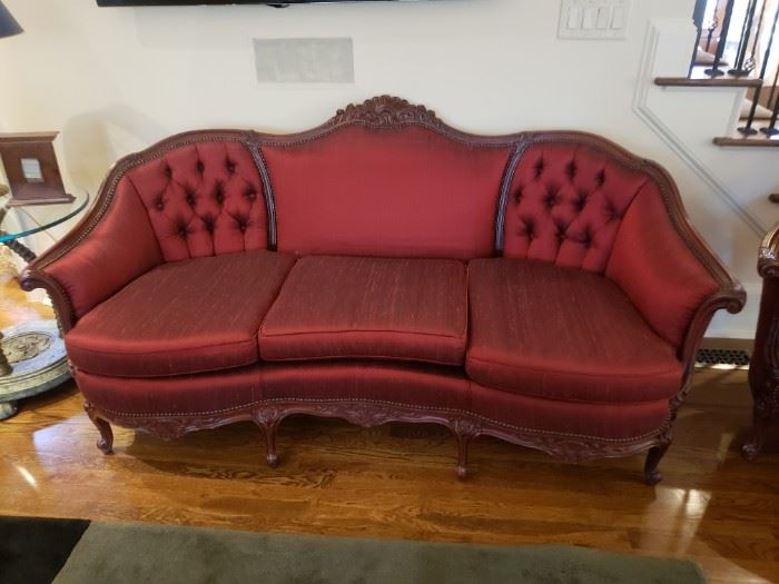1940s sofa reupholstered in a stunning red silk fabric