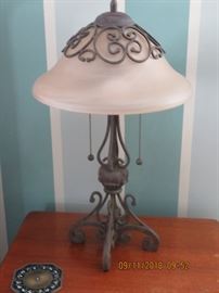 Forged iron and glass lamp.