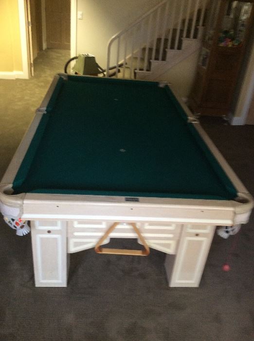 Brunswick Pool Table Excellent condition. With pool sticks, and balls.