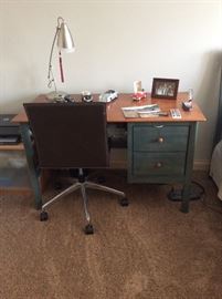 Two tone wood desk with chair.