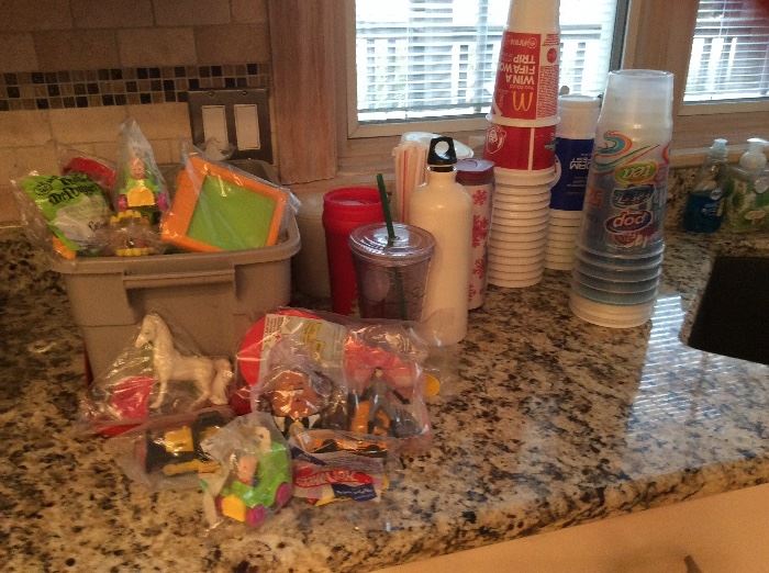 Unopened McDonald’s toys, cups lids Starbucks items. 