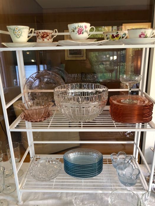  Pink depression glass, and tea cups and saucers.